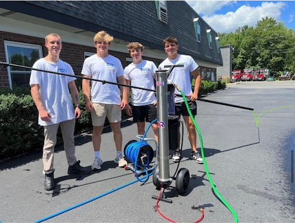 The Complete Window Cleaning crew with their water-fed pole equipment